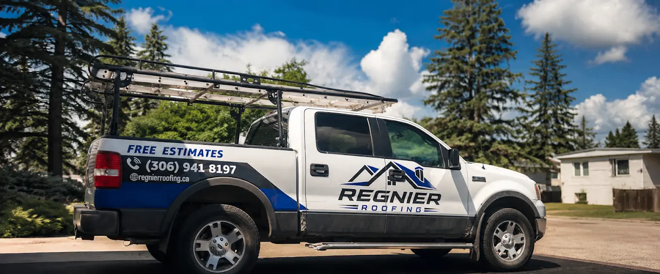 The Regnier Roofing pickup with a ladder rack, the logo on the door and Free Estimates with the phone number on the box